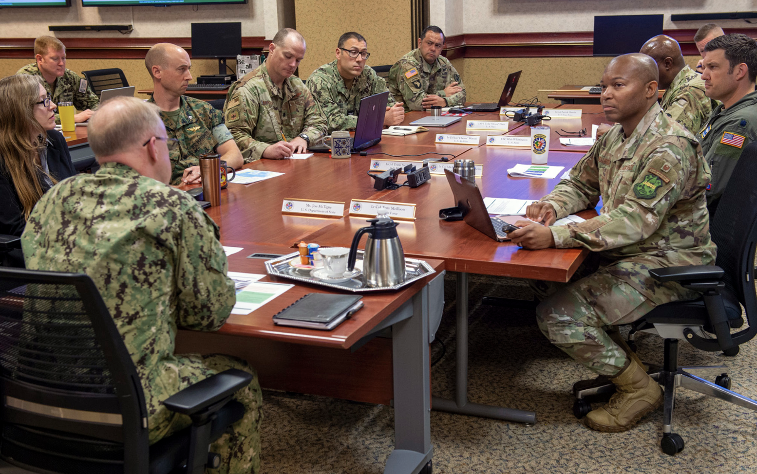Admiral Daryl Caudle, commander, U.S. Fleet Forces Command, foreground, engages with Joint Advanced Warfighting School students as hediscusses strategic and operational planning for foreign humanitarian crises, Norfolk, Virginia, April 6, 2023 (U.S. Navy/Theodore Green)